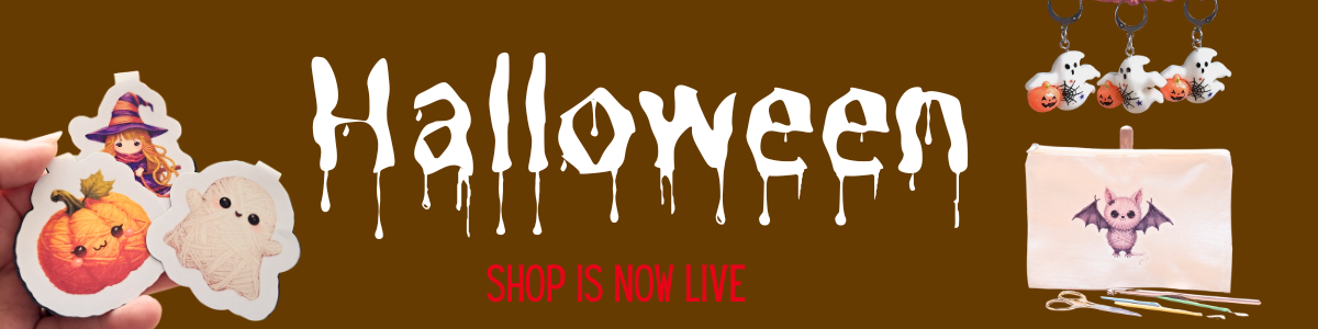 Halloween-themed promotional banner with the word 'Halloween' in dripping white font on a brown background, plus sample product cutouts including a pumpkin, ghost, witch sticker, hanging plush figures, and a small bat pouch. Text reads 'SHOP IS NOW LIVE'.