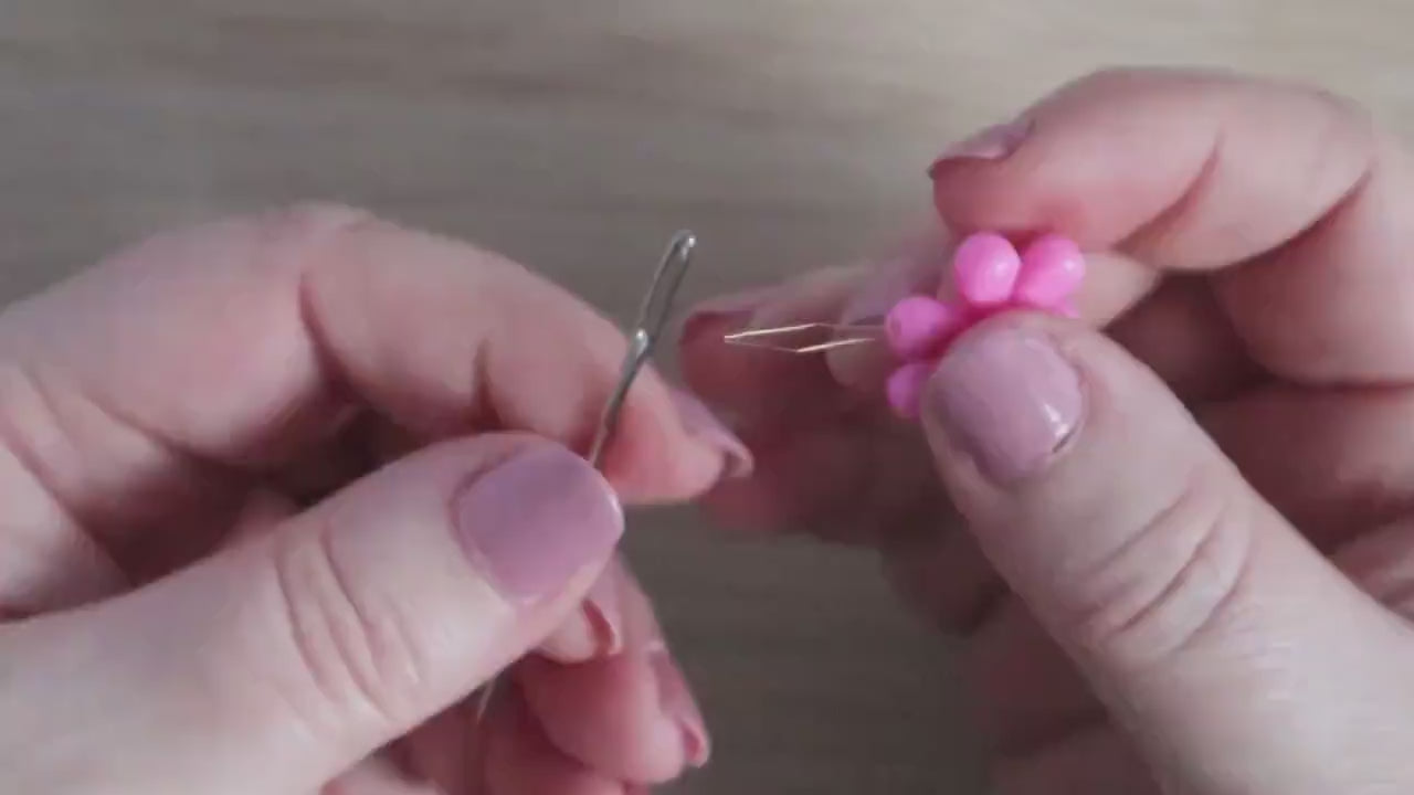 Daisy flower sewing needle threaded